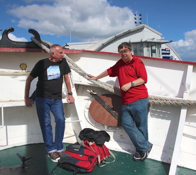 Ray Reynolds and Chris dance around their handbags