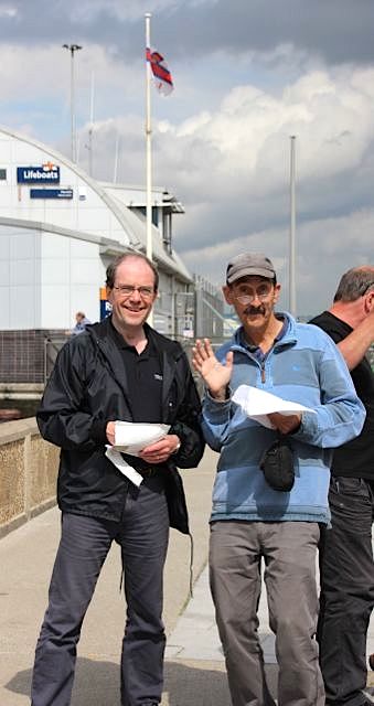 Two Tonys - Currie and O'Neil enjoy something from a paper bag