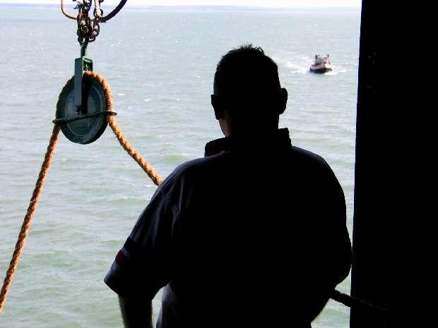 Justin watches the tender arrive